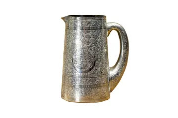 Old Silver Pitcher With Decorative Stamping Pattern isolated on white