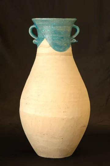 Oriental antique ceramic vase on a black background closeup