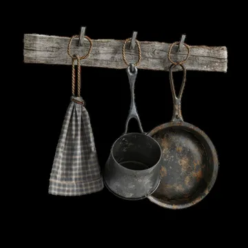 Rustic kitchen tools hanging on a wooden rack at night