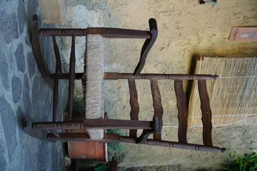Empty chairs against brick wall